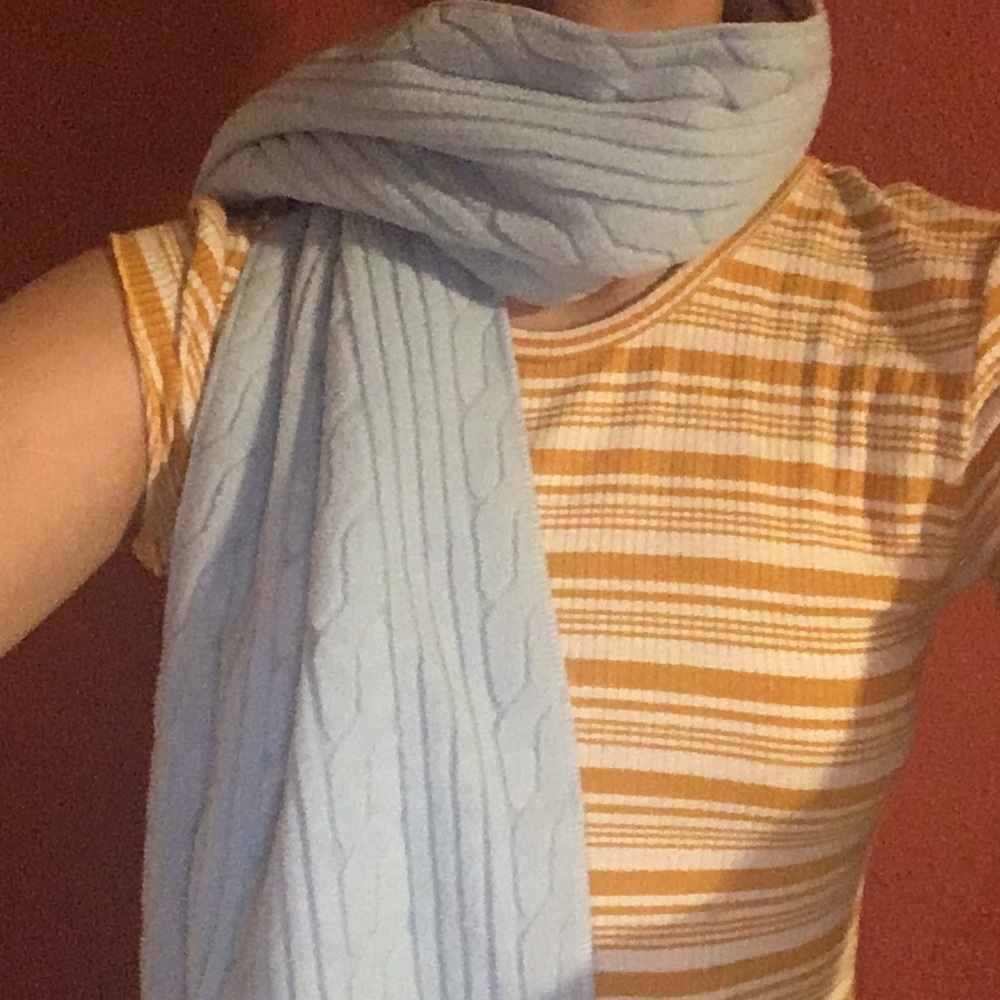 Light blue patterned scarf.